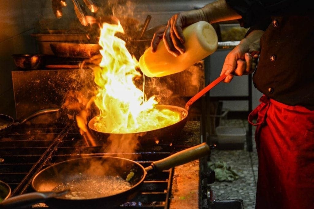 chef cooking over hot flame
