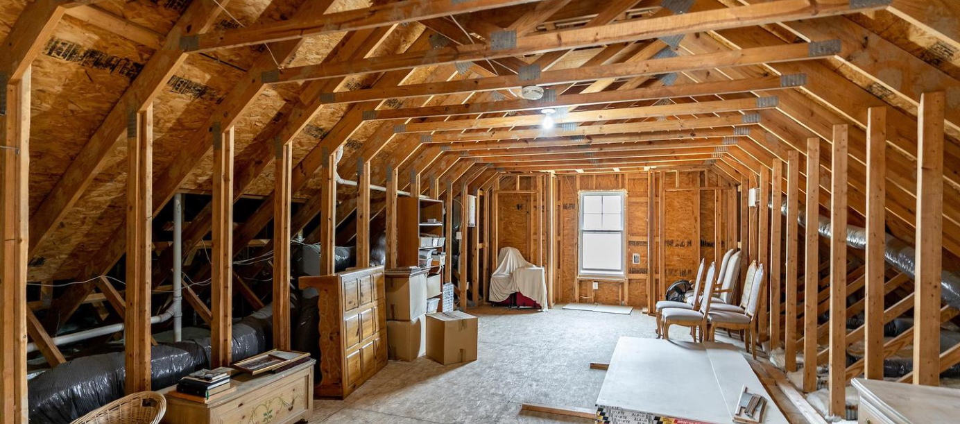 unfinished attic with storage items