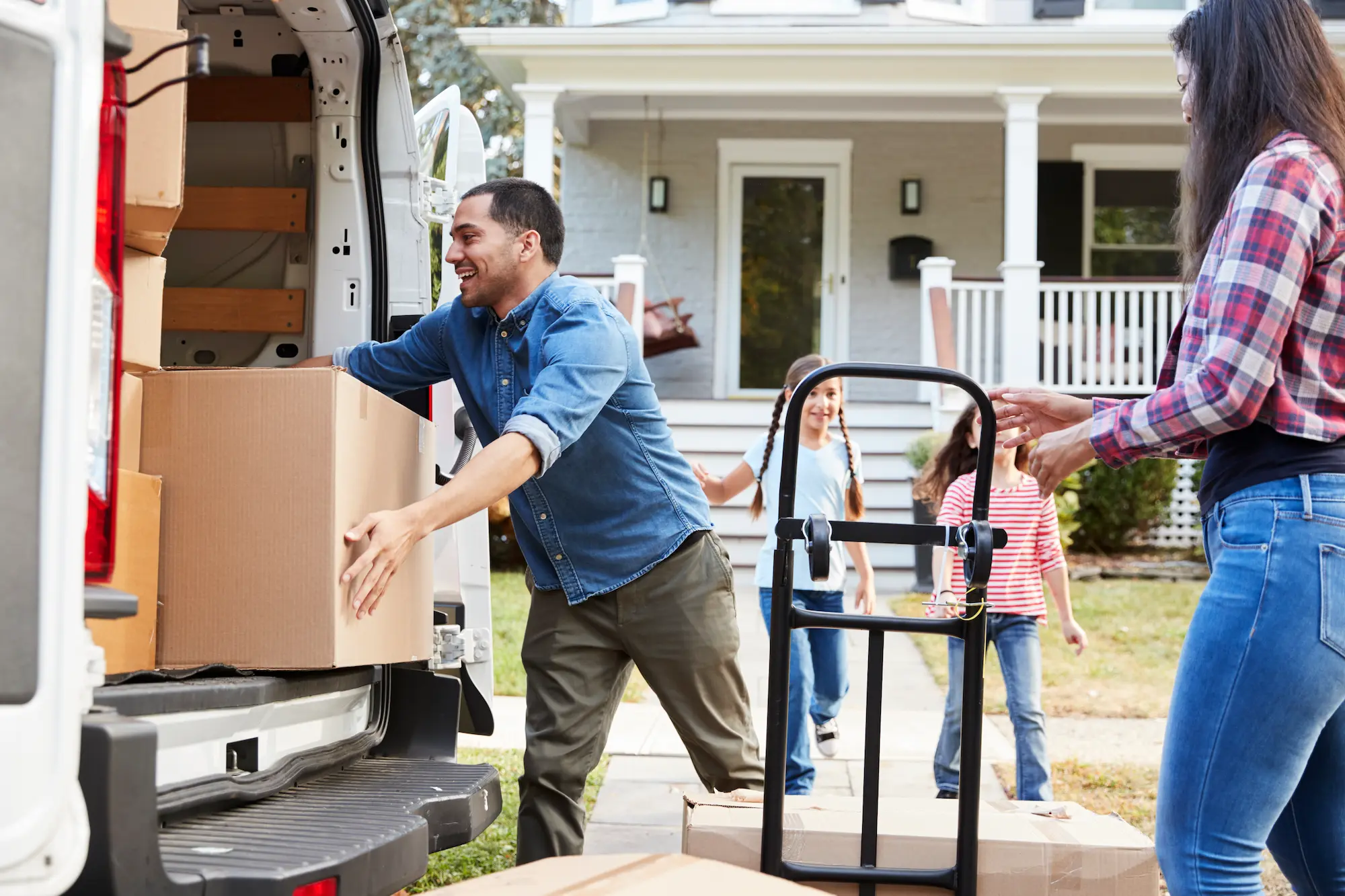 Family loading van with boxes