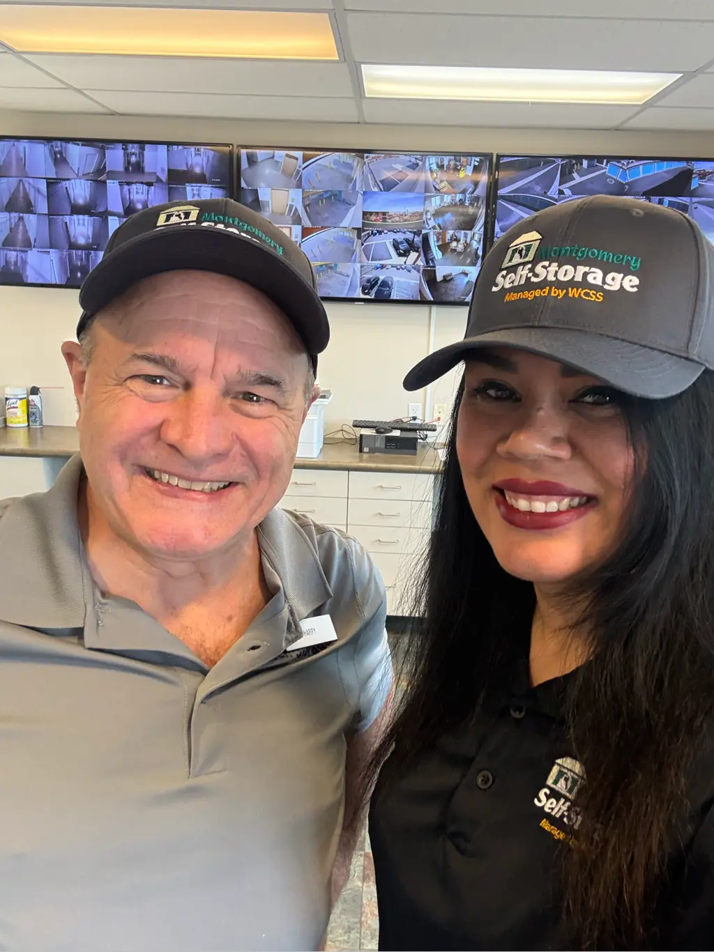 West Coast Self Storage team members smiling at the camera